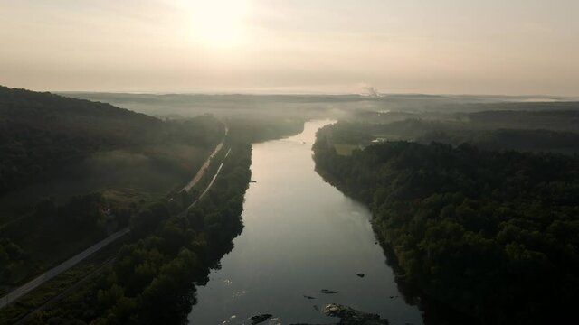 Mountainside Road By The Saint-Francois River On A Foggy Sunrise In Windsor, Quebec, Canada. - aerial drone shot