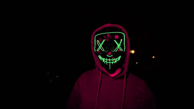 general shot traveling halloween mask with green led lights running chasing harassing killing scary dark scary the purge with red light violent night sequestration halloween party