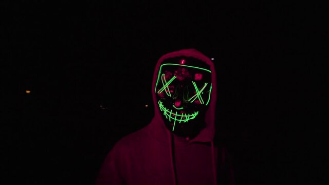 general shot traveling halloween mask with green led lights running chasing harassing killing scary dark scary the purge with red light violent night sequestration halloween party