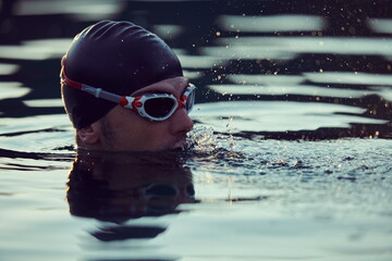triathlete swimmer having a break during hard training