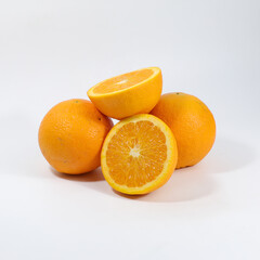 A pile of oranges together on a white background.