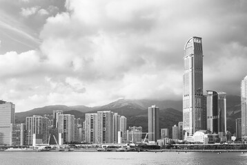 Skyline and harbor of Hong Kong city in black and white