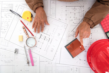 Architects compare house models to view drawings