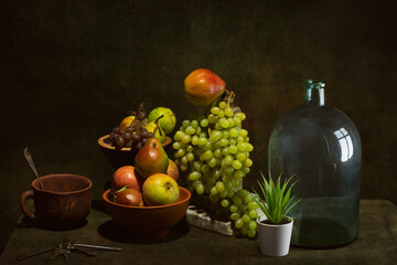 Still life with fruits and dishes on the table