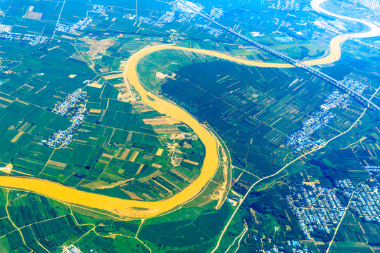 Aerial View Of The Green Earth And Winding River.