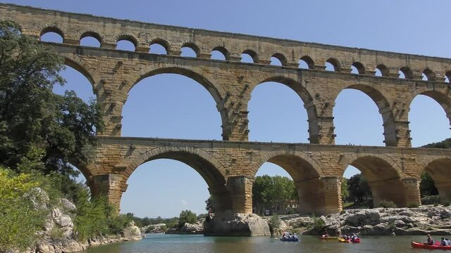 footage of Pont du Gard is an ancient Roman aqueduct that crosses the Gardon River near the town of Vers-Pont-du-Gard in southern France and popular tourist destination 4k quality