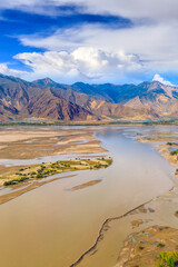 Aerial view of mountain and river with sky clouds natural landscape in Tibet,China.