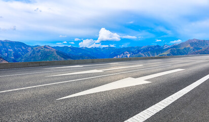 Asphalt road and mountain with sky clouds landscape.
