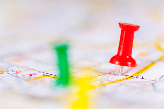 Colorful push pins on a map