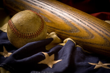 Vintage, antique baseball equipment on American flag bunting