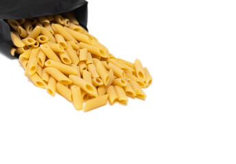 pasta close-up on a white background. Pasta spilled out of the package.