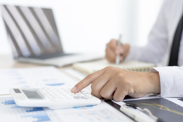 Finance workers are analyzing data in a private office.