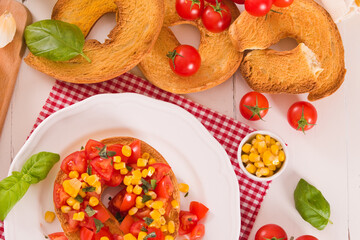 Friselle with tomatoes and mais.