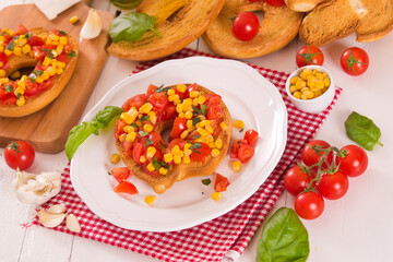 Friselle with tomatoes and mais.