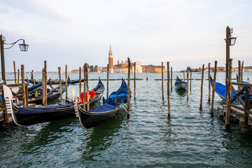Fototapeta na wymiar Gondolas at the Piazza San Marco in Venice, Italy, with San Giorgio Maggiore in the back