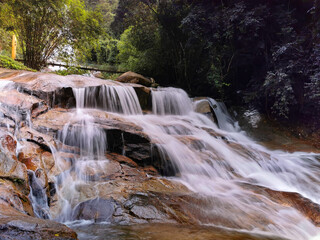 Fototapeta na wymiar A view of waterfall in forest. Lata Kinjang is located about 18 km from Tapah in state of Perak, Malaysia. 