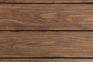 Fototapeta premium Brown wooden planks background. Wood texture background with striped pattern, viewed from above.
