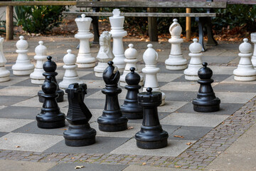 Chess board and pieces in park