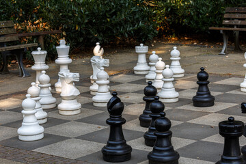 Chess board and pieces in park