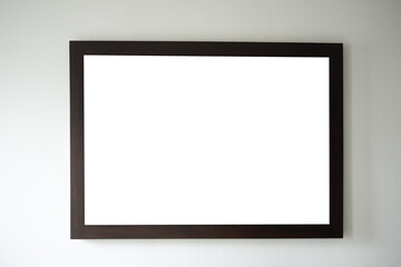 Vintage photo frame on the warm wall with a light focus shape and copy space
