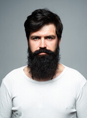 Obraz premium Barber with long beard and moustache in barbershop. Bearded man.