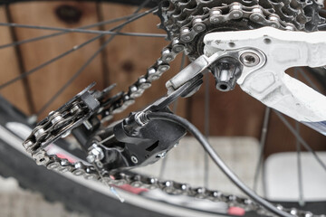 Fototapeta na wymiar Bicycle detail breakage. Bent bike rear derailleur hanger. 