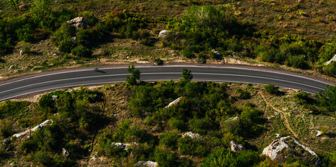 The road through the countryside. Landscapes of the country. Travel to beautiful places by bike. Road trip the perfect road. Aerial survey of the road. Copy space