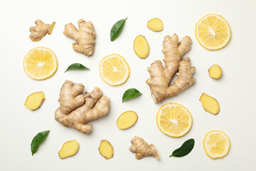 Fresh ginger and lemon on white background, top view