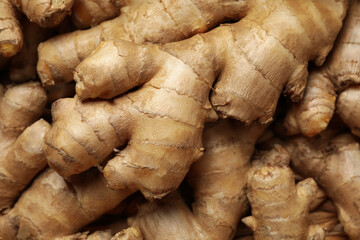 Fresh raw ginger on whole background, close up - Powered by Adobe