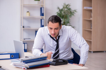 Fototapeta premium Sick male employee suffering at workplace