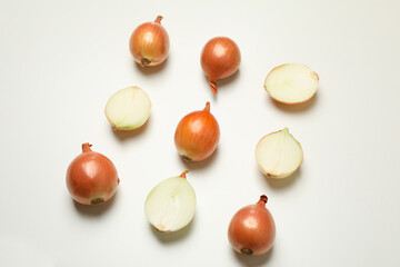 Flat lay with fresh onion on white background, top view