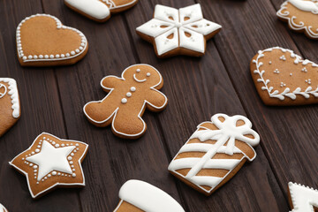 Many different delicious Christmas cookies on wooden table