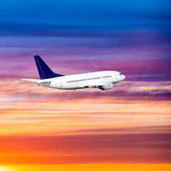 Fototapeta na wymiar airplane on sunset background. Passenger airliner. Commercial aircraft. Private jet