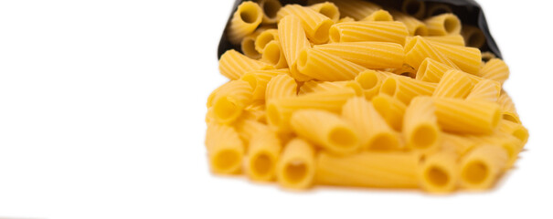 pasta close-up on a white background. Pasta spilled out of the package.