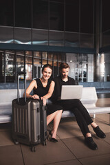 Fototapeta na wymiar Man and woman waiting for a flight together