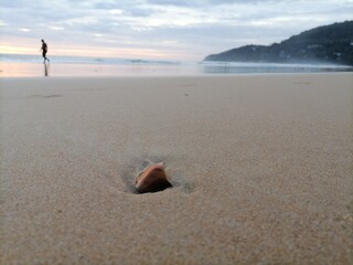 Fototapeta na wymiar Beautiful beach with a high rate of broken glass
