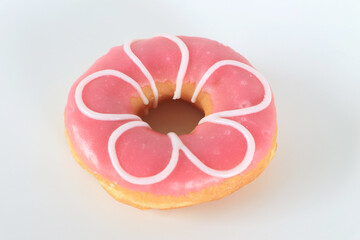 Pink donut on white background.