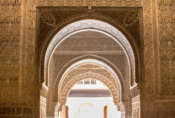 Ornate arches in a Lions patio of Alhambra, Granada, Spain