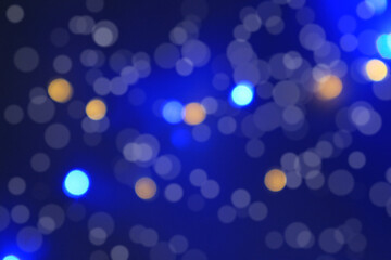 abstract background of blurred warm lights with cool blue.