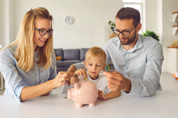 Curious little kid saving up money and learning about financial literacy from young parents