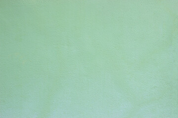 Soft green concrete wall surface and cement background textures for interior or exterior decoration.
