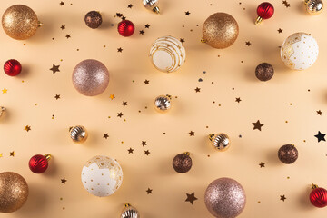 Minimalistic round Christmas white, red and gold balls on a neutral background with stars