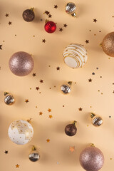 Minimalistic round Christmas white, red and gold balls on a neutral background with stars
