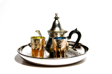 Group of teapot and glasses of oriental tea on a tray on white background