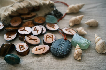 wooden runes in a canvas bag with a stone runescript