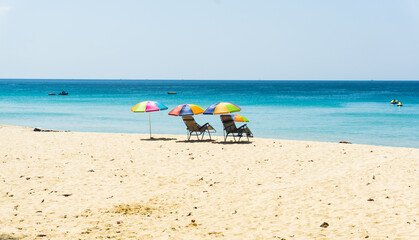 Fototapeta na wymiar White beaches, sea and beautiful sky of Phuket, with 2 beach cha