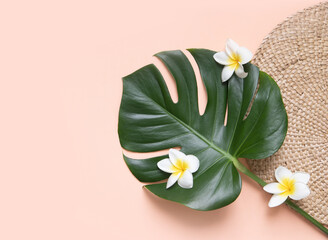 Tropical background with palm leaves monstera and flower. © Kotkoa