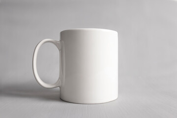 Empty mug mock-up, Close up white coffee cub isolated on grey background, Blank front view classic white mug mockup, Concept branding mock up for design your logo design.