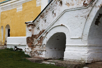 Old stone staircase of the Rostov Kremlin chambers with peeling plaster.Side view. Architecture of the Rostov Kremlin buildings.