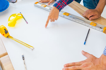 Group of architects woking on blank blueprint